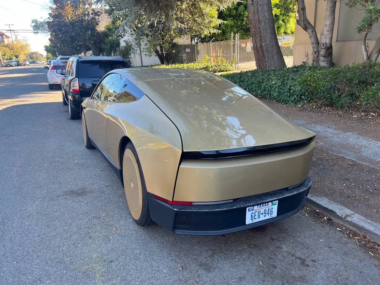 Gold Tesla Cybercab rear three-quarter view with Texas manufacturer plate, parked in Berkeley