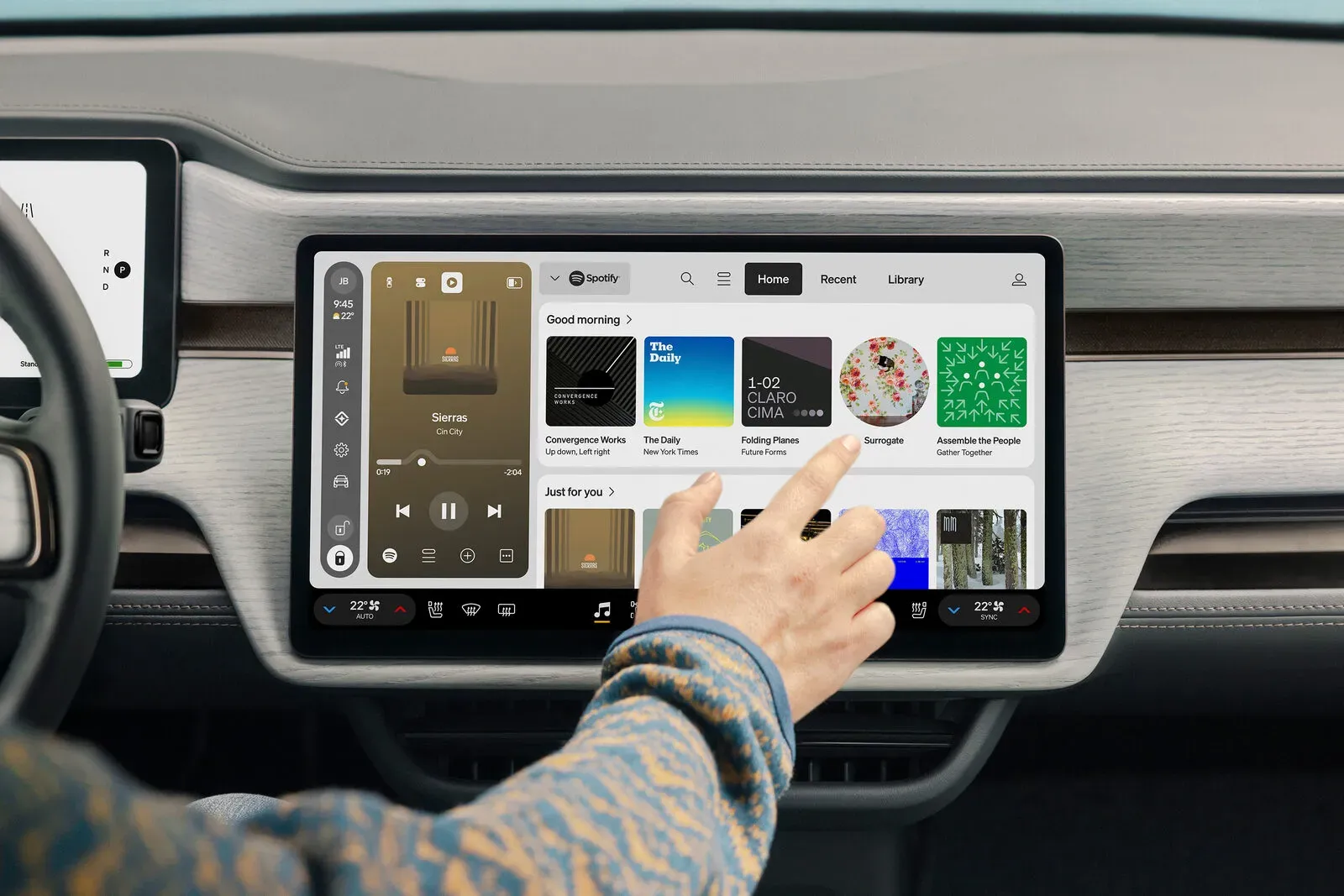 Rivian center touchscreen running the redesigned RivianOS 2 media interface with Spotify